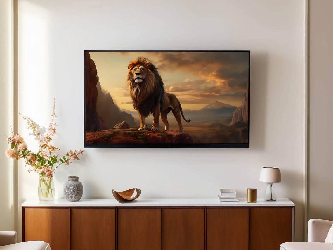 Majestic Lion Standing Tall at Sunset on Rocky Cliffs Wildlife Poster - Image 2