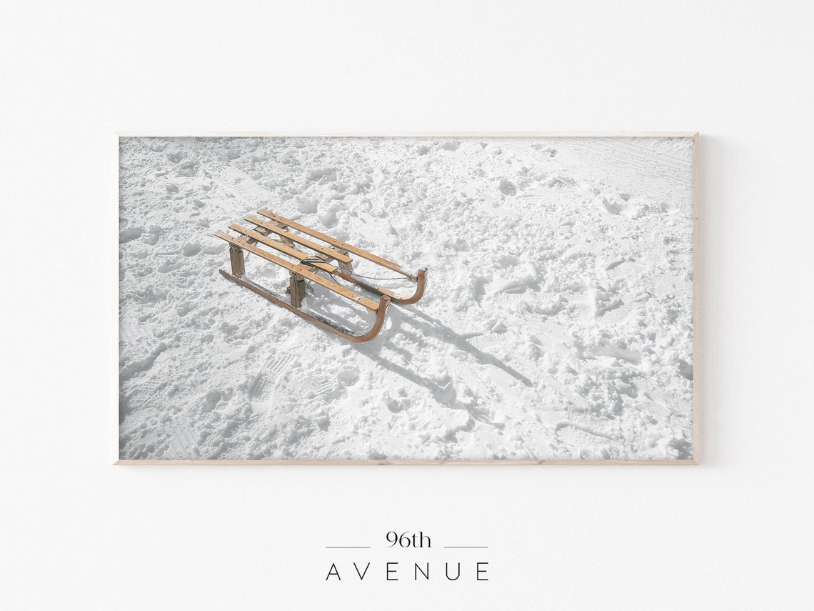 Vintage Wooden Sled Resting on Fresh Snow Nostalgic Winter Poster