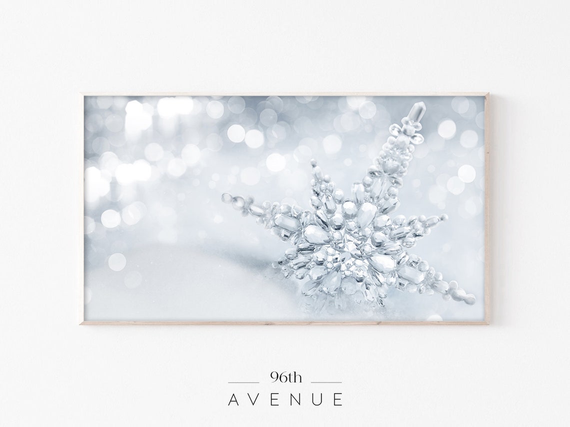 Crystal Ice Snowflake Ornament with Snowy Bokeh Background Poster