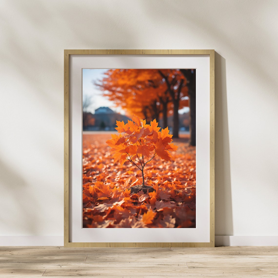 Small Orange Maple Sapling Among Fallen Autumn Leaves Poster
