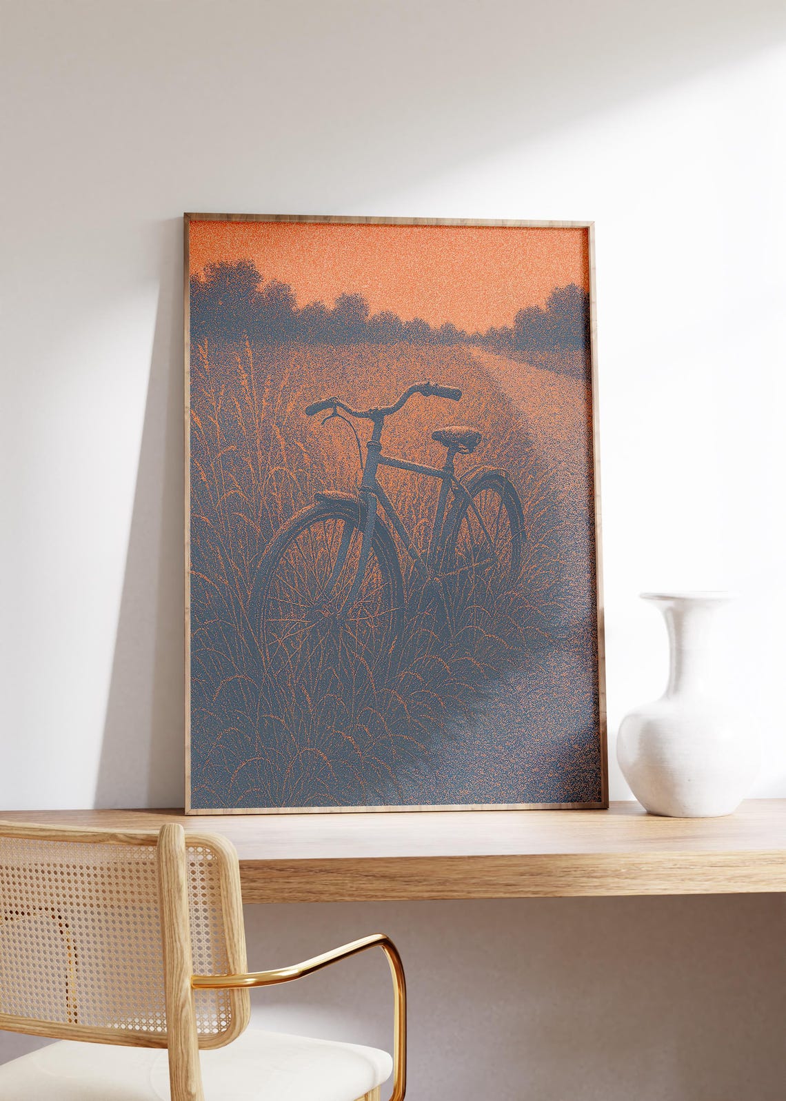 Vintage Bicycle in Tall Grass under Orange Sunset Sky Poster