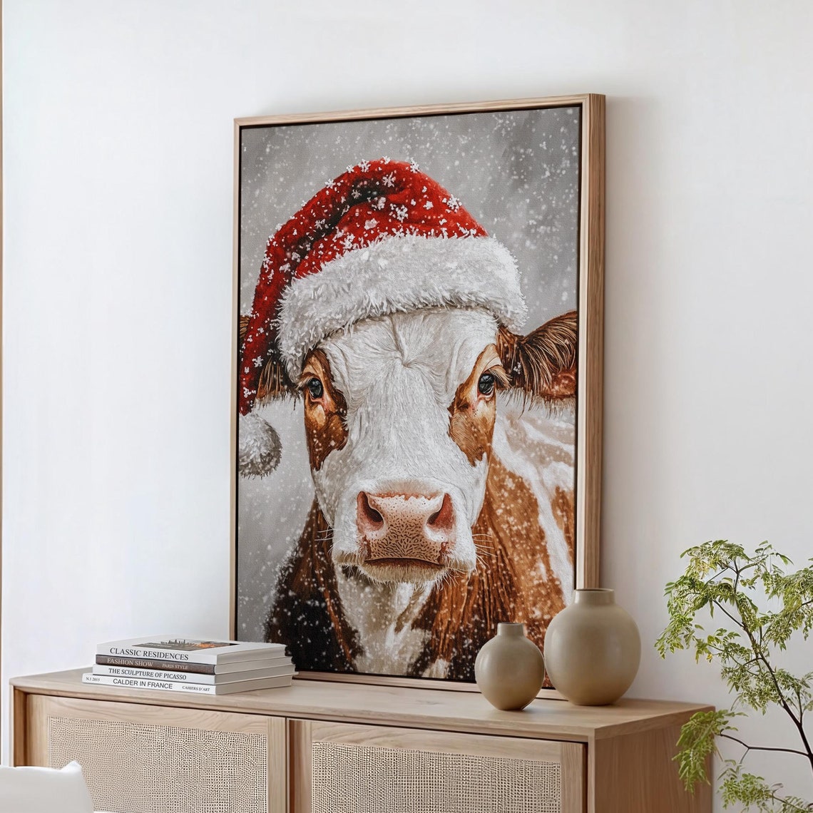 Adorable Cow in a Santa Hat Smiling on a Snowy Christmas Day Poster