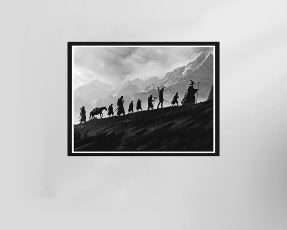 Wizard Leading Travelers Over Snowy Mountains Silhouette Art Poster