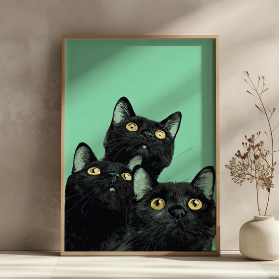 Three Black Cats With Bright Golden Eyes Teal Background Wall Art