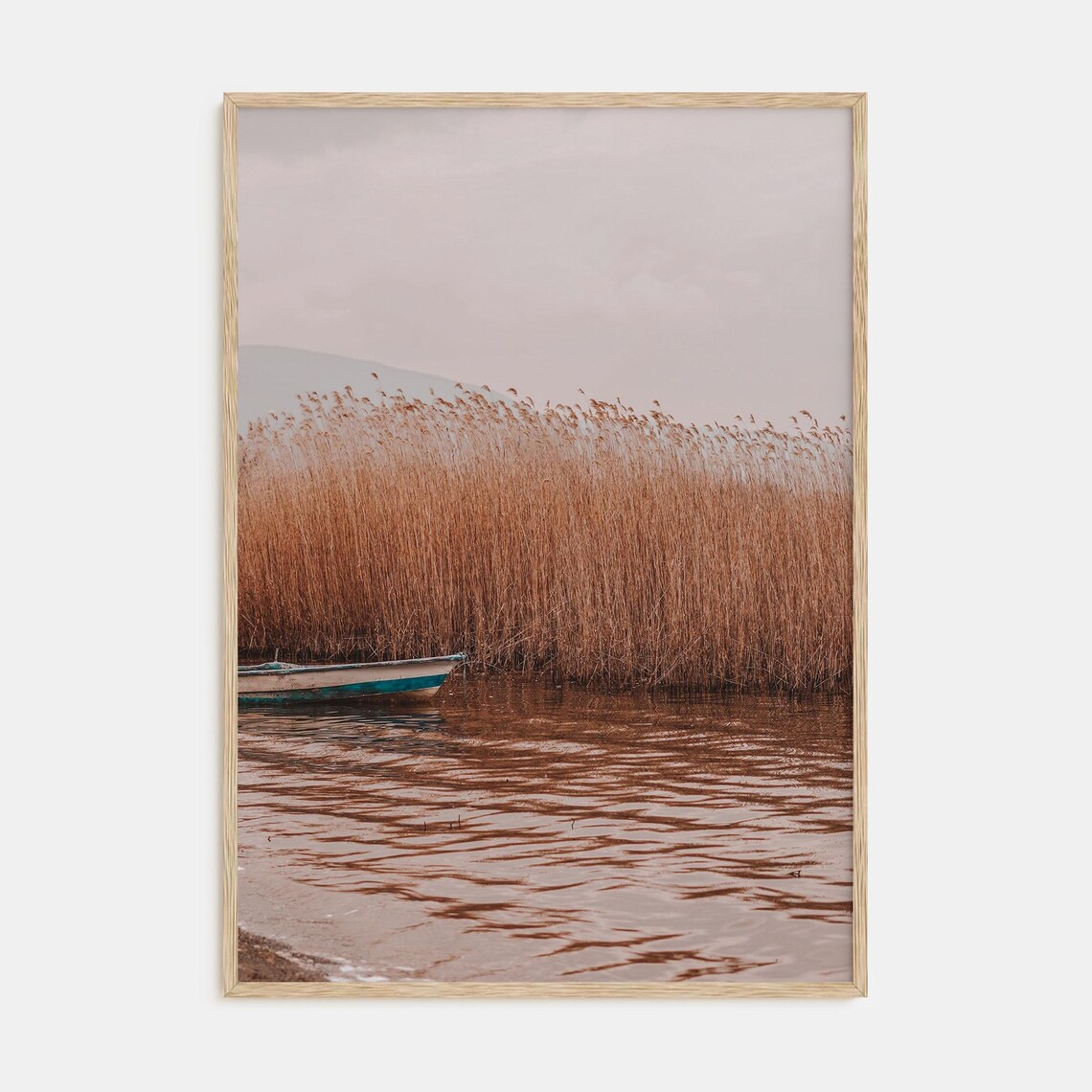 Golden Reeds Lake Shore Rowboat Serene Nature Photography Poster
