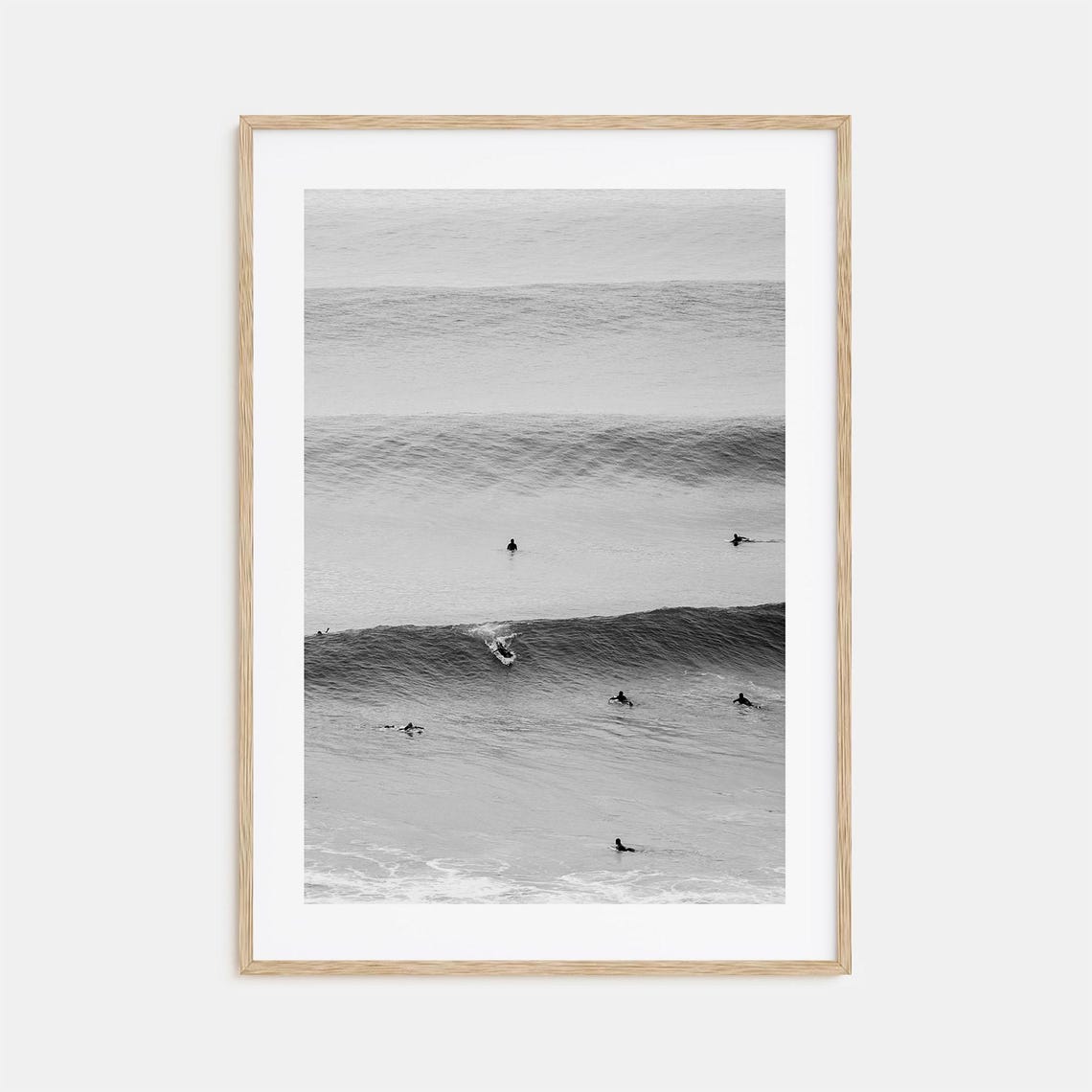 Distant Surfers Waiting On Rolling Ocean Swells Black And White Poster