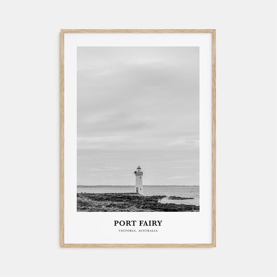 Port Fairy Australia Lone Lighthouse On Rocky Shoreline Poster