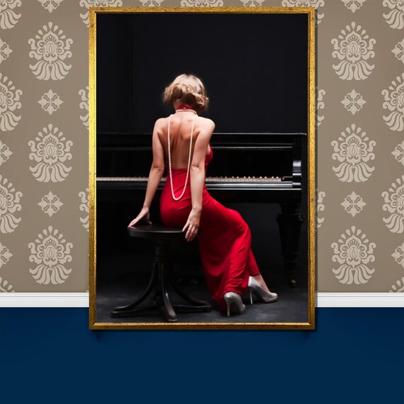 Woman in Red Backless Dress with Pearls at Piano Photo Poster
