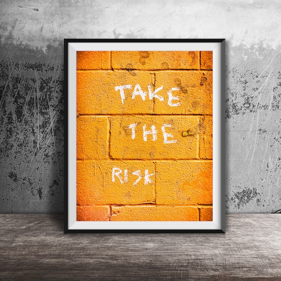 Take the Risk Bold White Graffiti on Orange Brick Wall Poster