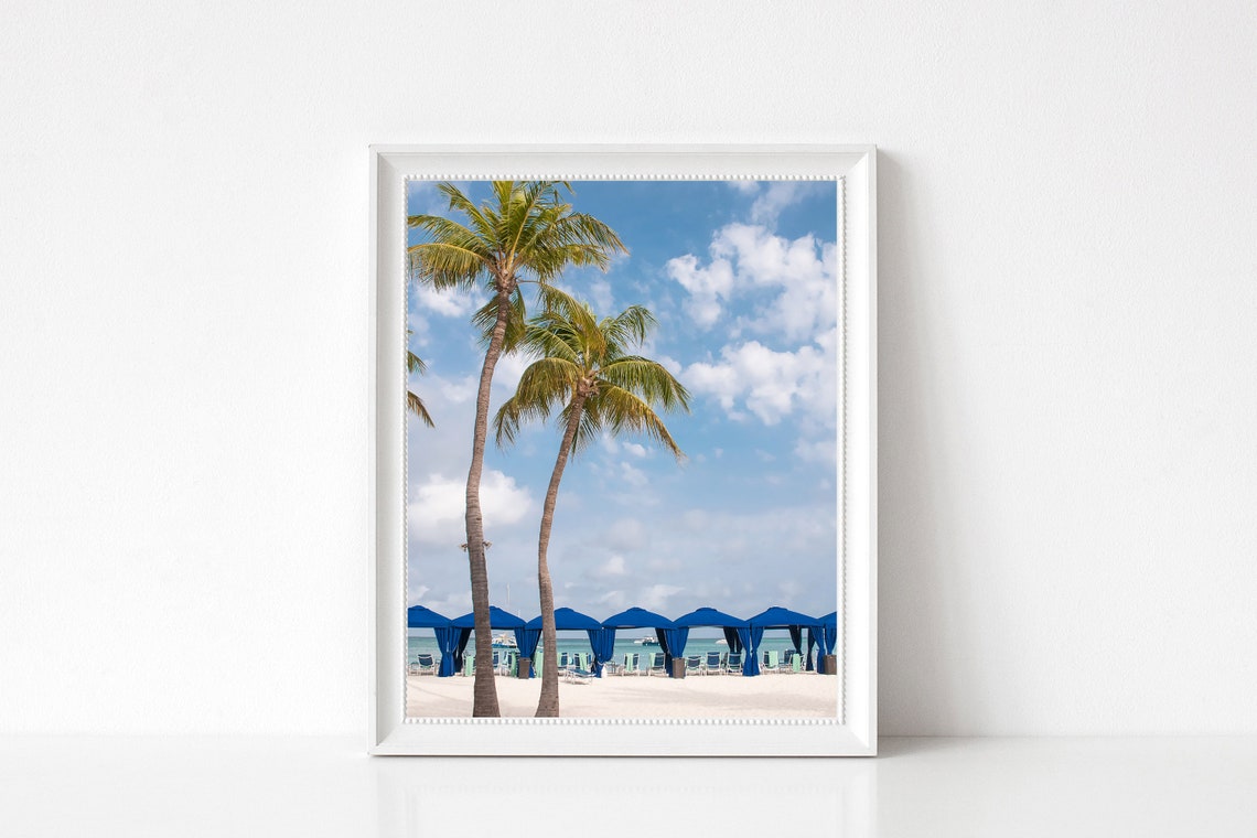 Leaning Palm Trees and Blue Beach Cabanas by the Ocean Poster - Image 3