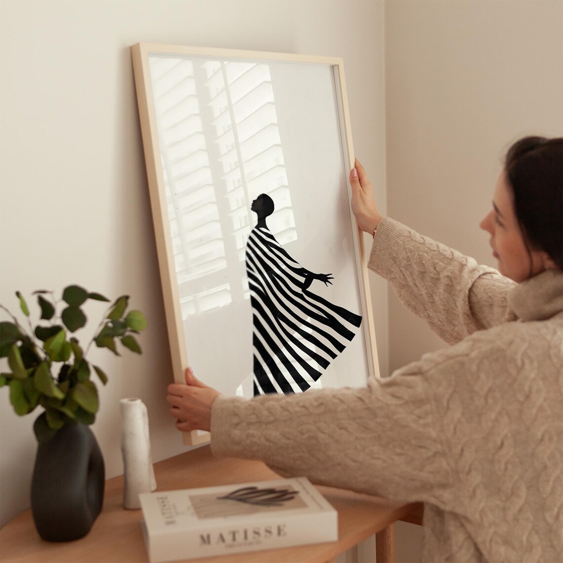 Elegant Black Silhouette Woman in Striped Flowing Dress Poster - Image 3