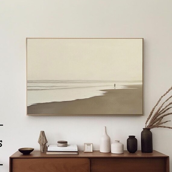 Minimalist Beige Beach Scene With a Lone Figure Walking on Sand Poster