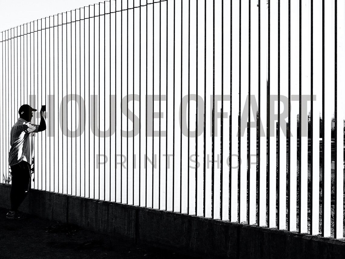 Man By City Fence Black And White Modern Contrast Photography Print - Image 2