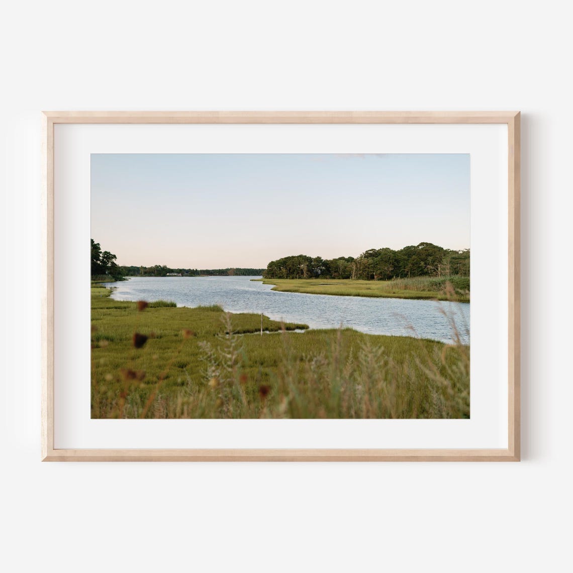Peaceful Marsh Waterway Winding Through Green Grass at Dusk Poster