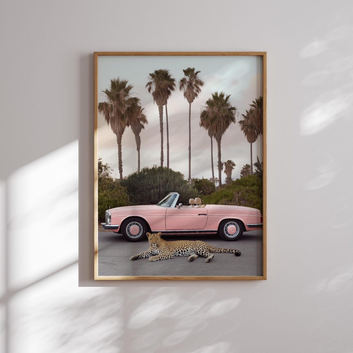Playful Leopard Lounging Before a Pink Vintage Convertible Poster - Image 2