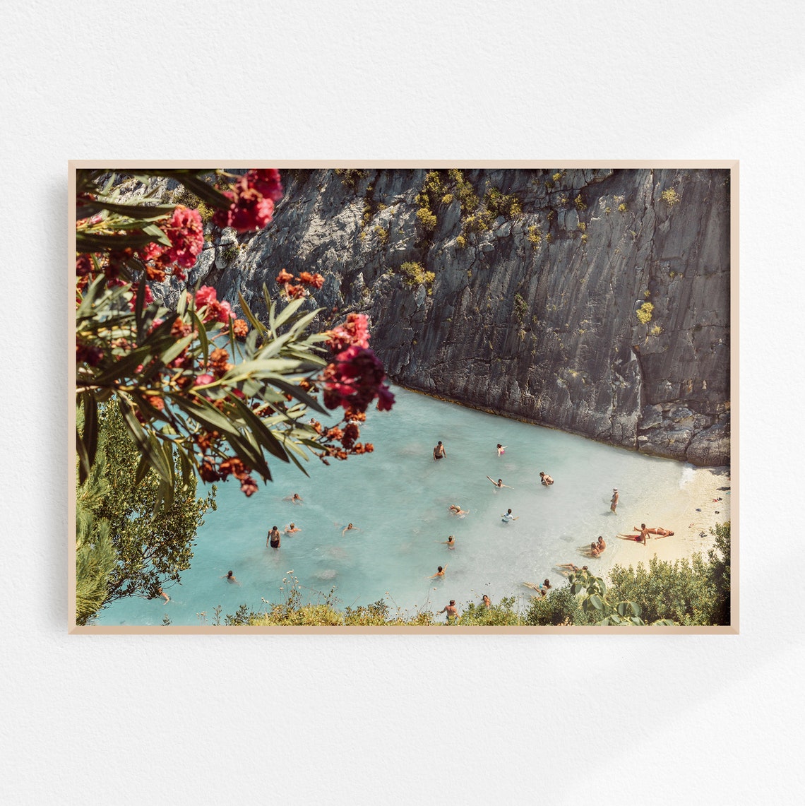Greek Island Cove with Swimmers Under Cliffs and Flowers Poster