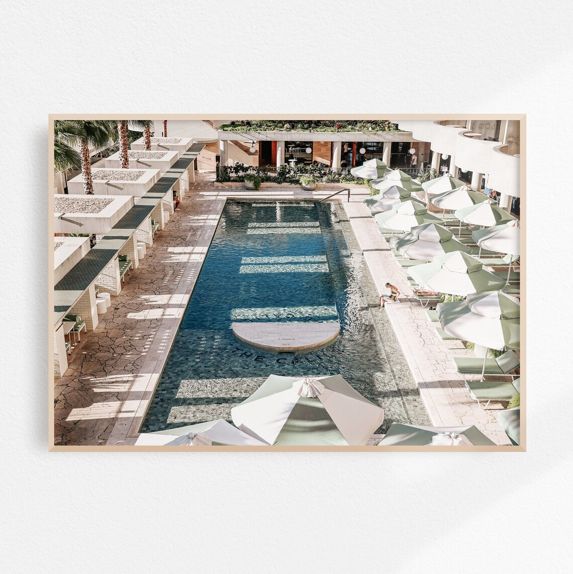 Aerial Hotel Pool with Striped Parasols Resort Courtyard Poster