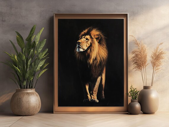 A Male Lion Standing Tall Against a Dramatic Black Backdrop Poster