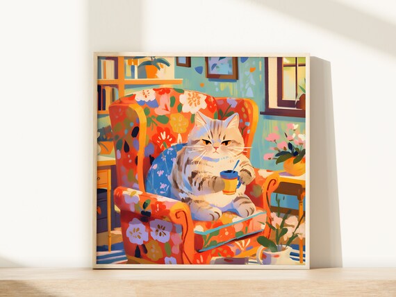 Cream Tabby Cat Sipping from a Striped Mug in a Floral Chair Poster