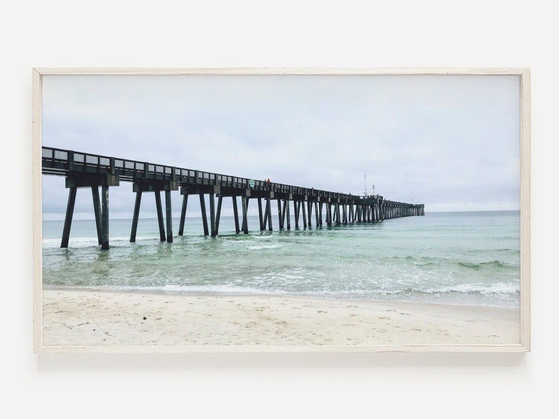 Weathered Wooden Pier Stretching Over Muted Ocean Waves Poster
