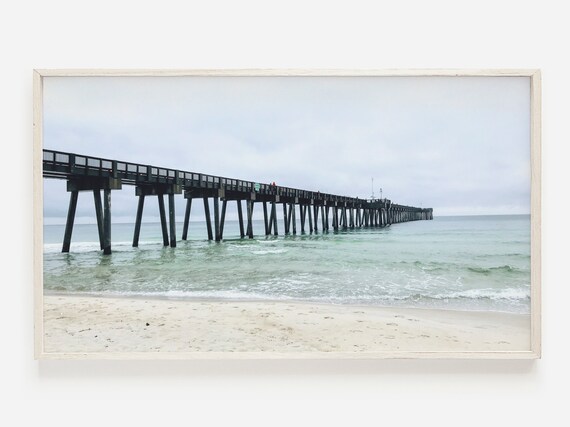 Weathered Wooden Pier Stretching Over Muted Ocean Waves Poster
