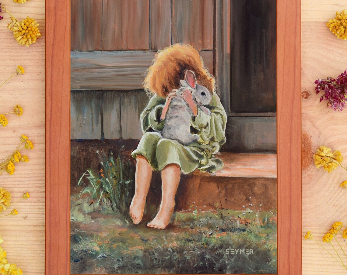 Little Girl with Curly Red Hair Cuddling a Rabbit on a Porch Poster