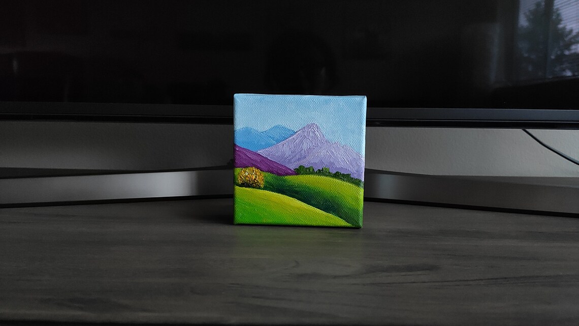 Purple Blue Mountain Peaks Over Green Rolling Hills Landscape Art Poster - Image 2