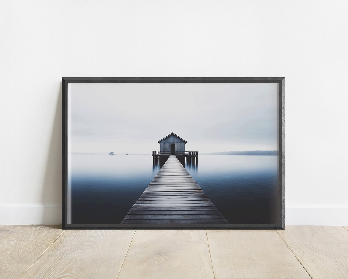 Minimalist Boathouse at End of Wooden Pier on Still Blue Water Poster