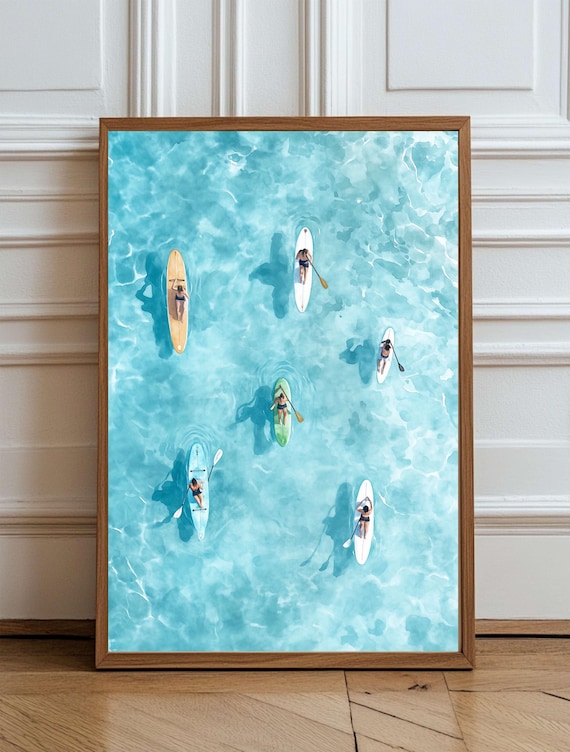Aerial View Of Paddleboarders On Turquoise Ocean Water Poster