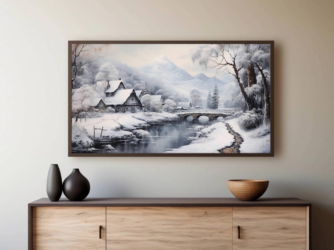 Snowy Mountain Village with a River Bridge in Winter Wall Art - Image 2