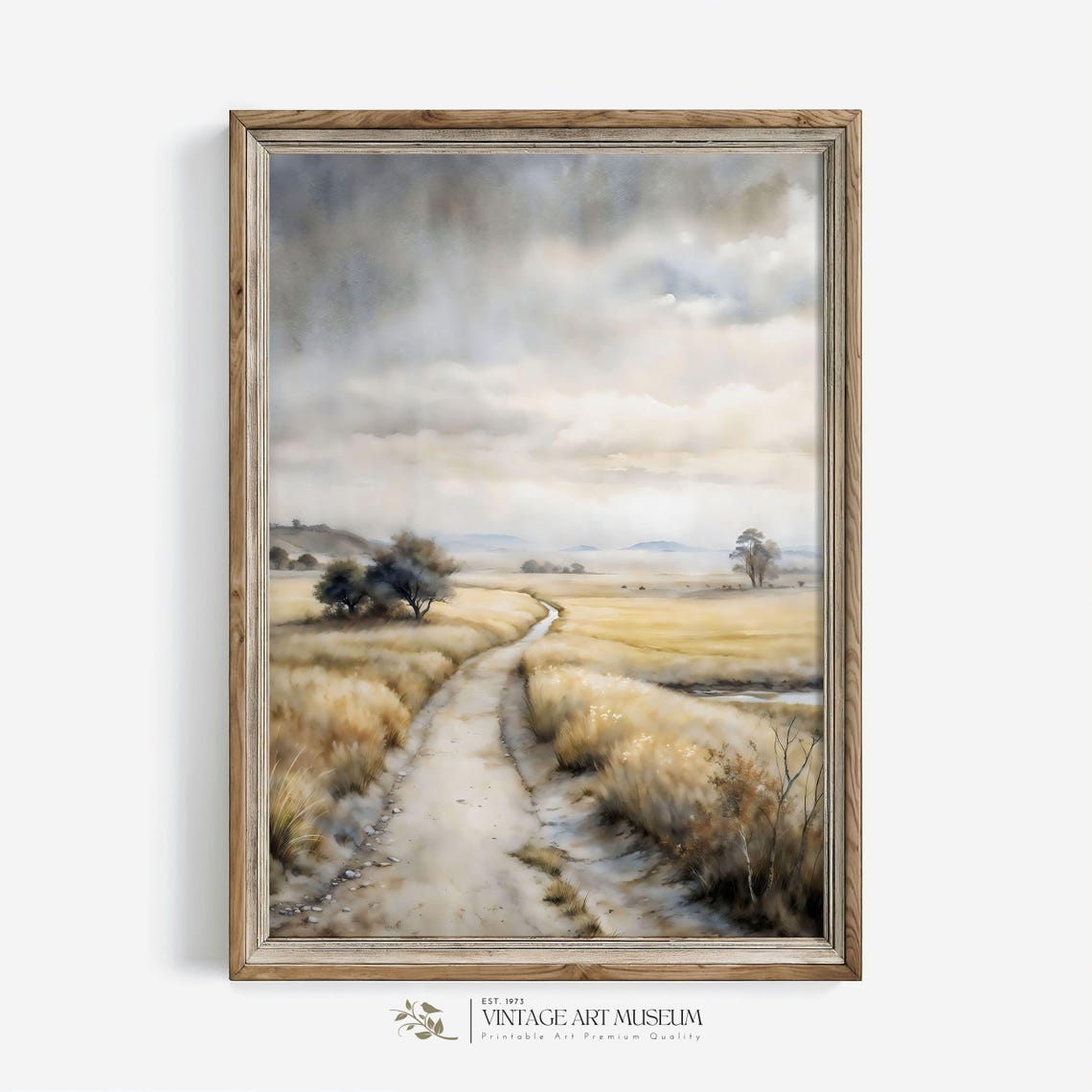 Golden Field with a Winding Dirt Road Under a Cloudy Sky Art Poster