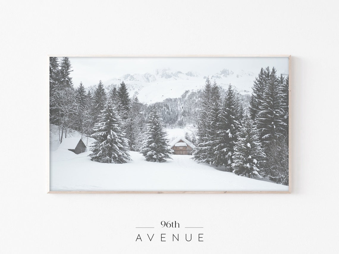 Snowy Mountain Cabins Tucked Among Evergreens in Winter Poster