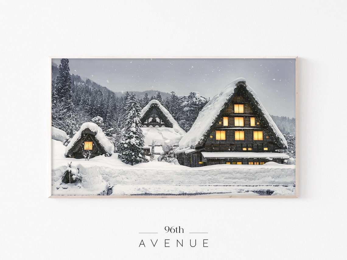 Snow Covered Farmhouses with Warm Glowing Windows at Night Poster