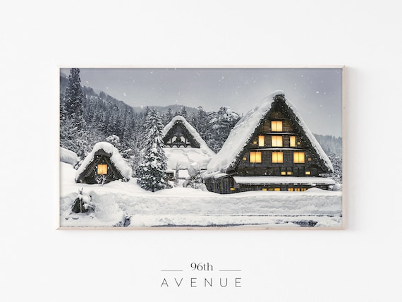 Snow Covered Farmhouses with Warm Glowing Windows at Night Poster