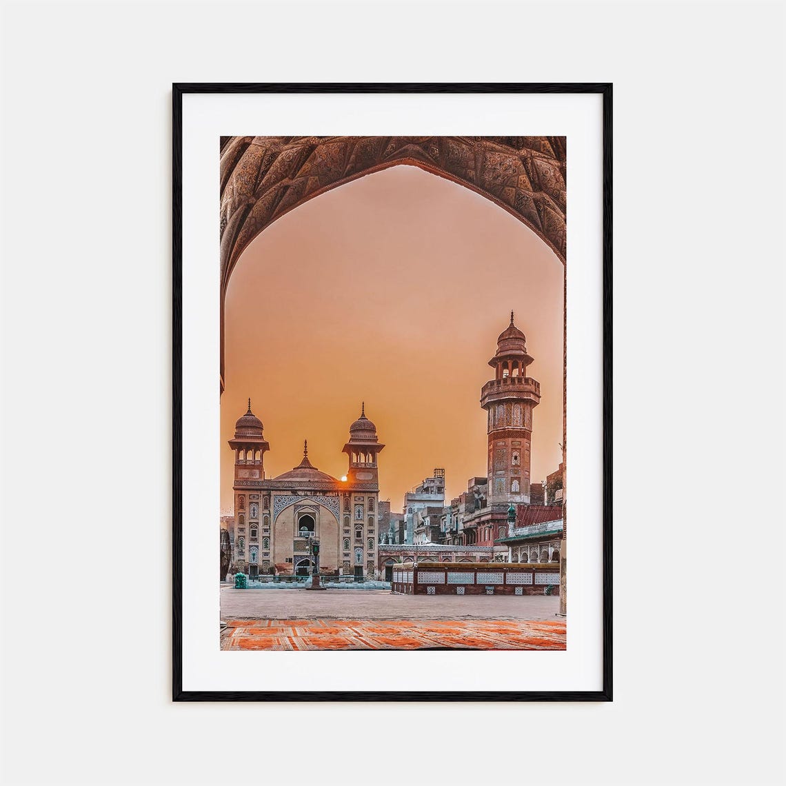 Lahore Historic Mosque Framed by Stone Arch at Sunset Poster