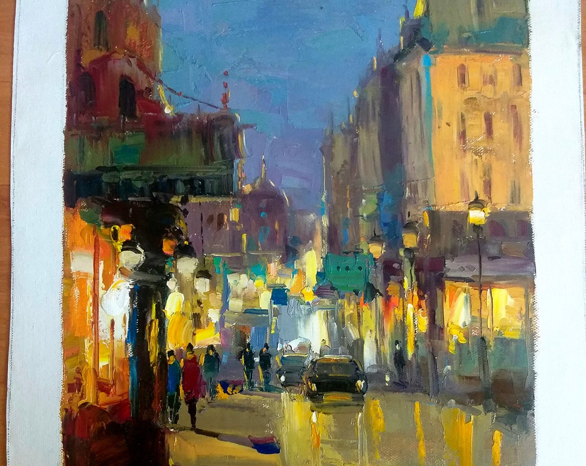 Rainy Evening City Street Glowing Storefronts Night Lights Poster