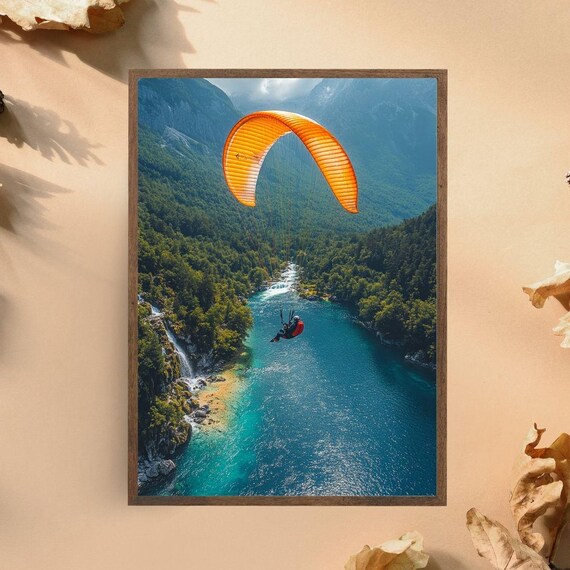 Paragliding Over Turquoise Mountain River Orange Canopy Adventure Poster
