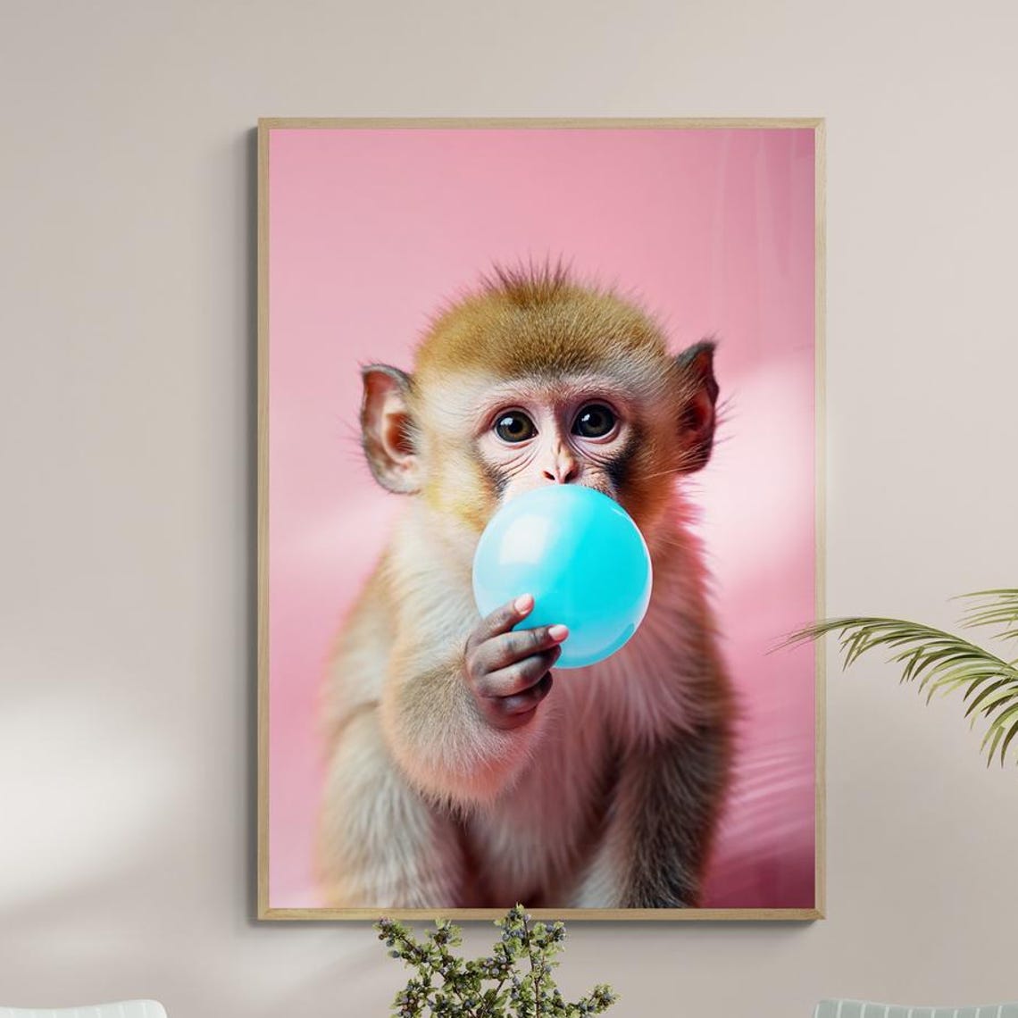 Baby Monkey Blowing Blue Bubblegum Bubble on Pink Background Poster
