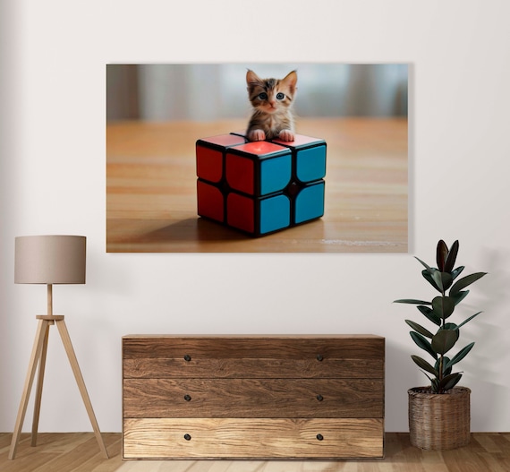 Tiny Tabby Kitten Peeking Over A Giant 2x2 Rubiks Cube Poster