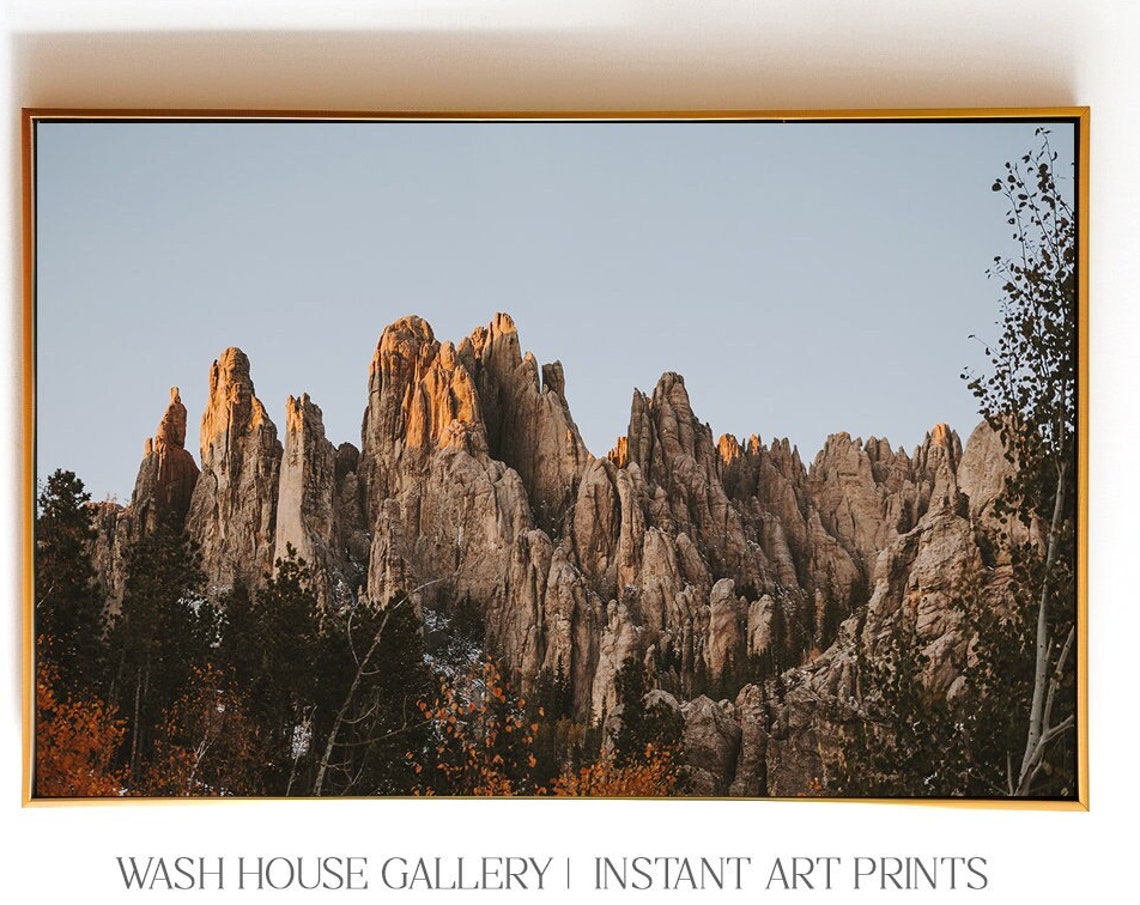 Sunlit Sandstone Rock Spires at Golden Hour Landscape Poster