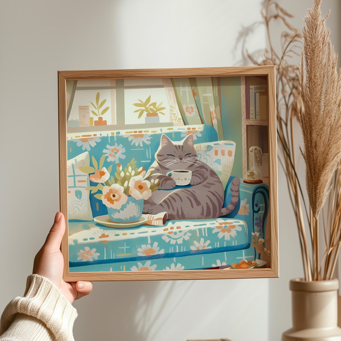 Calm Grey Tabby Cat with Coffee Cup on Blue Floral Sofa Poster - Image 3