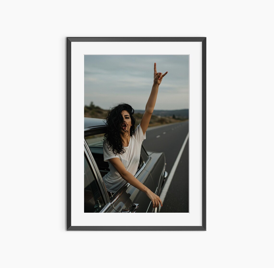 Woman Flashing Rock Hand Sign From Classic Car Window Sunset Photo Print