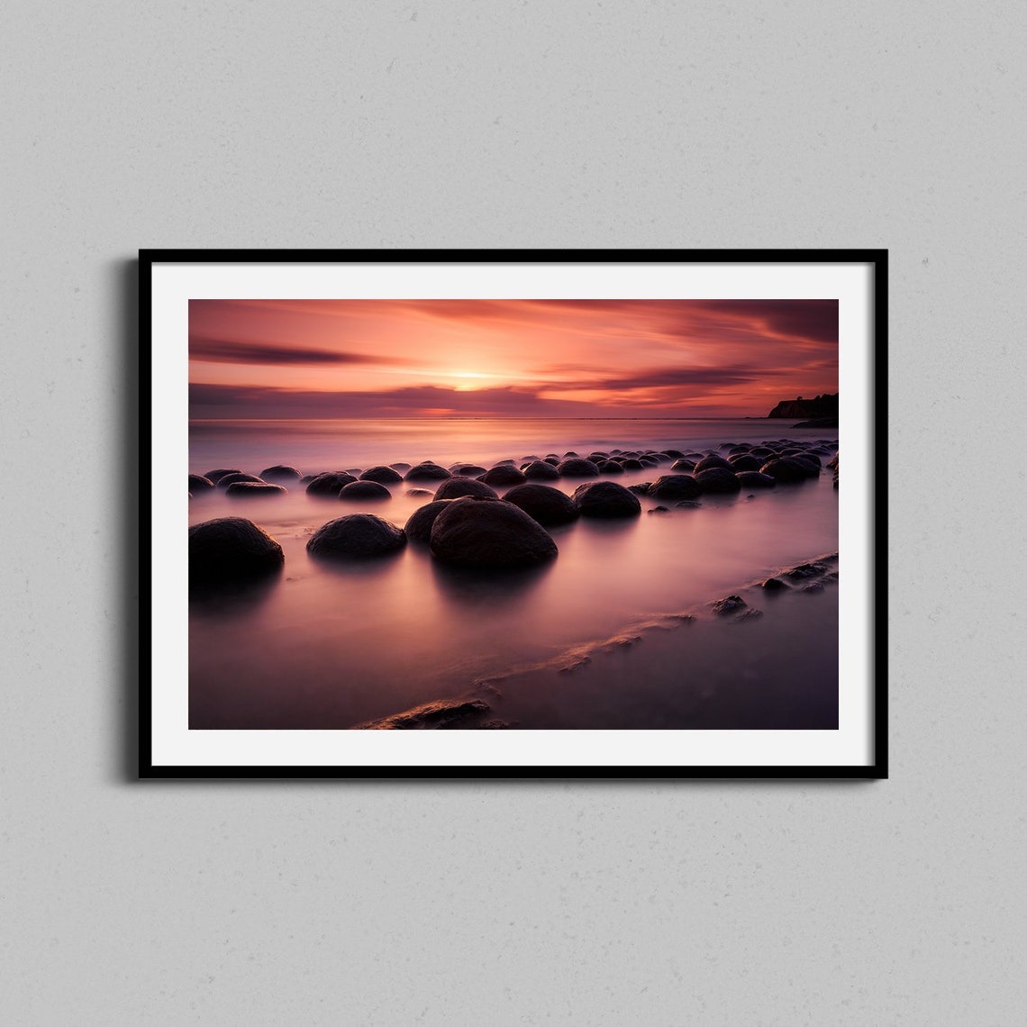 Warm Pacific Sunset Over Rounded Shore Rocks Photo Art Poster