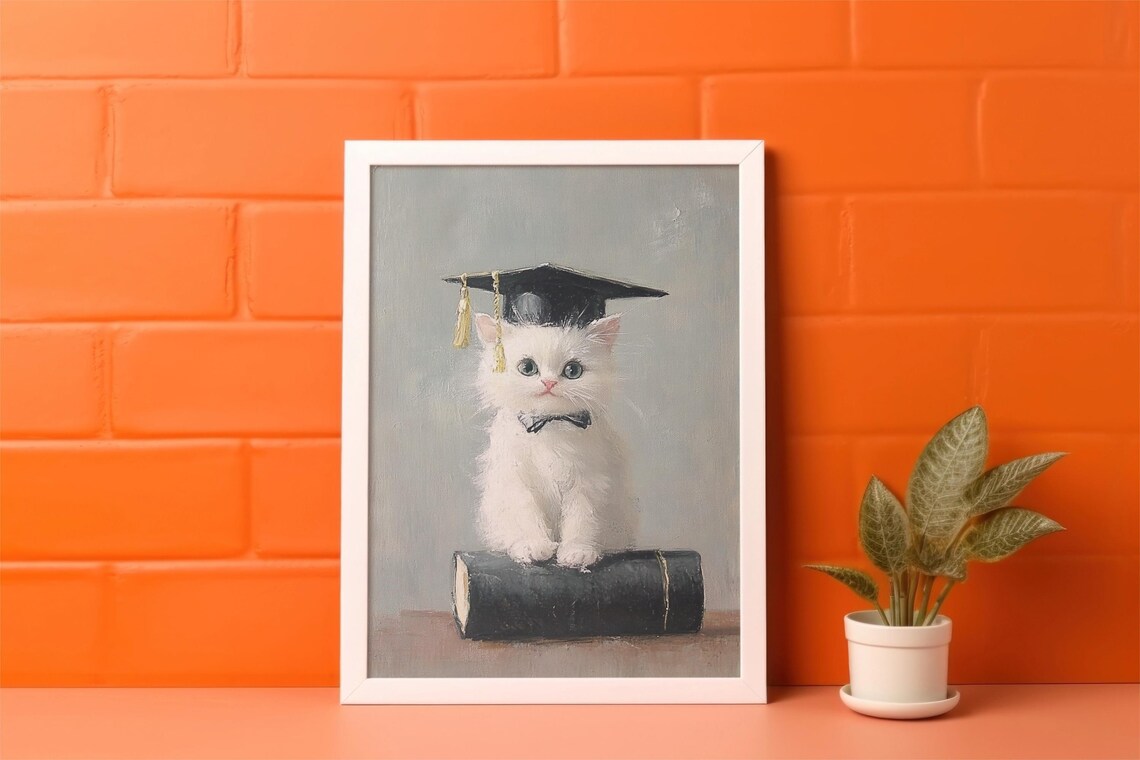 White Kitten in Graduation Cap with Bow Tie Sitting on Book Poster - Image 2