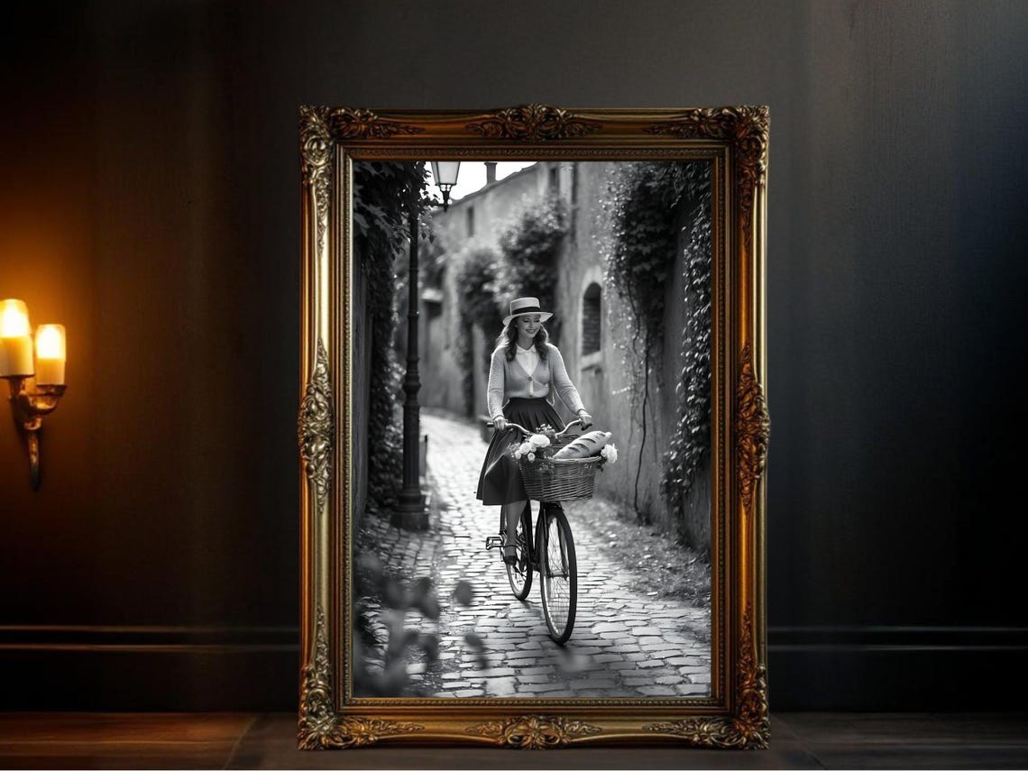 Woman Cycling Cobblestone Alley with Baguette-Filled Basket Poster