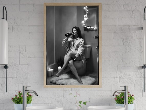 Woman Drinking From A Bottle In A Cozy Candlelit Bathroom Poster