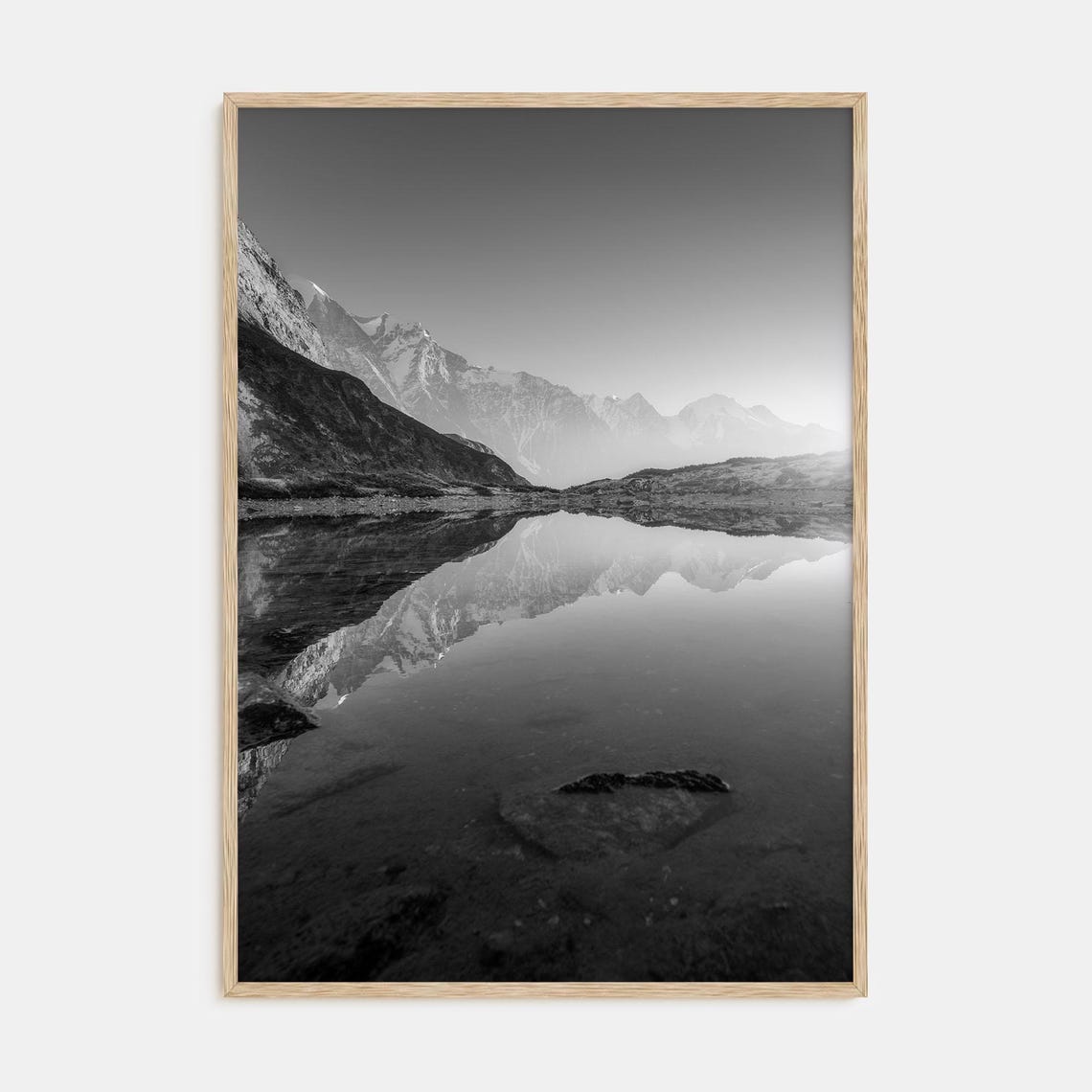 Black and White Snow-Capped Peak Mirrored in a Still Lake Poster