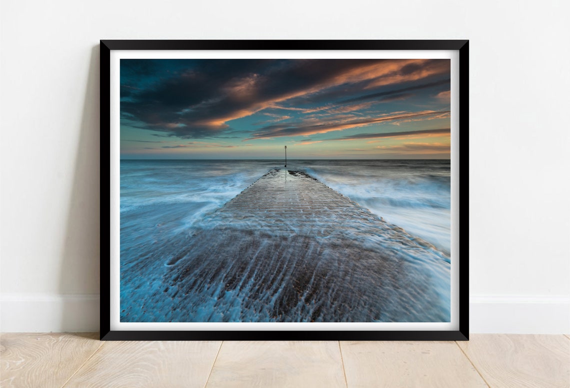Ferring Beach Sunset with Stone Breakwater and Ocean Waves Poster