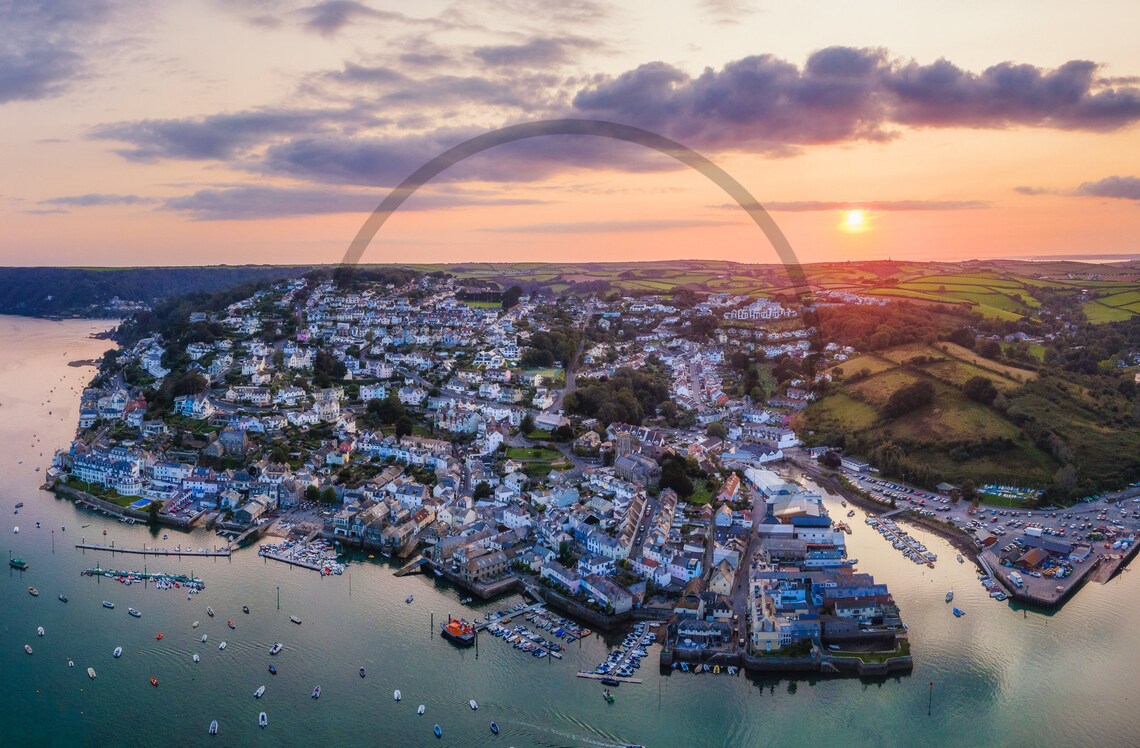 Aerial View of a Coastal Town at Sunset Over the Harbor Poster - Image 3
