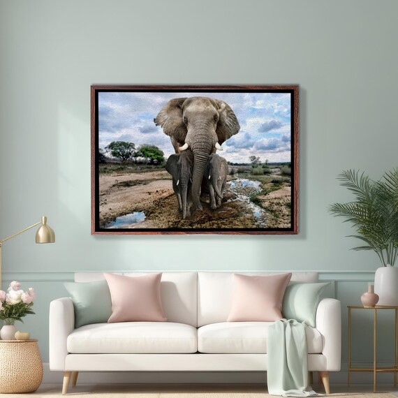 African Elephant Shielding Her Calves at the Waterhole Safari Poster